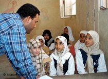 Arab teacher conducts his lesson in an elementary school; (photo: AP)