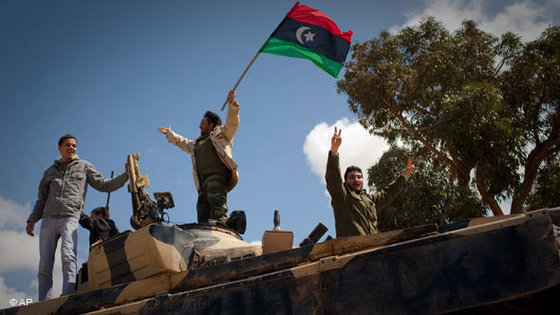 Libyan rebels celebrate after taking Benghazi in March 2011 (photo: AP)