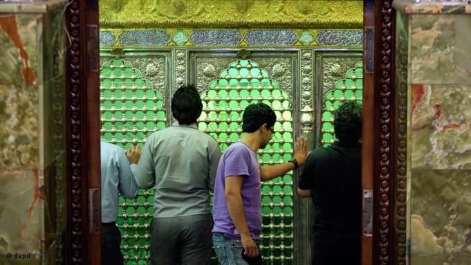 Ramadan sees increased numbers of the faithful visiting holy shrines, to express their wishes and prayers. Iranian Shiites touch the grave of Saleh at his mausoleum north of the capital Tehran