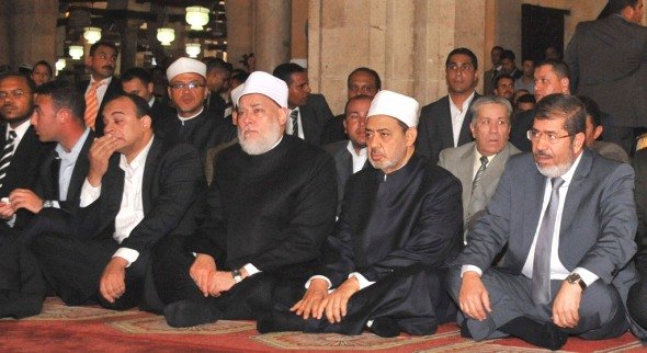 Egypt's president-elect Mohamed Morsi (R) attends Friday prayer at al-Azhar mosque in the old quarter of Cairo June 29, 2012, together with Ahmed Muhammad Ahmed el-Tayeb, the current Grand Imam of Al-Azhar, sitting to the left of Morsi (photo: Reuters)