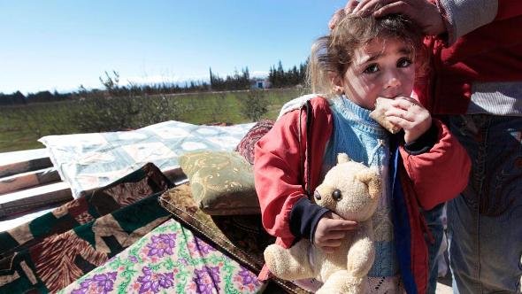 A Syrian child is seen who fled from the Syrian town of Qusair near Homs, at the Lebanese-Syrian border village of Qaa, eastern Lebanon, Monday, March 5, 2012 (photo: Hussein Malla/AP/dapd)