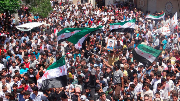 Demonstration by opponents of the Syrian regime in Talbiseh (photo: Reuters)