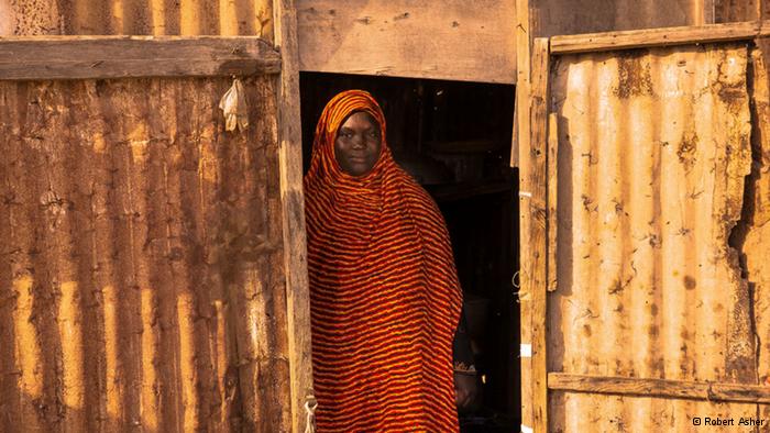 A Hratine woman standing in a doorway (photo: Robert Asher)