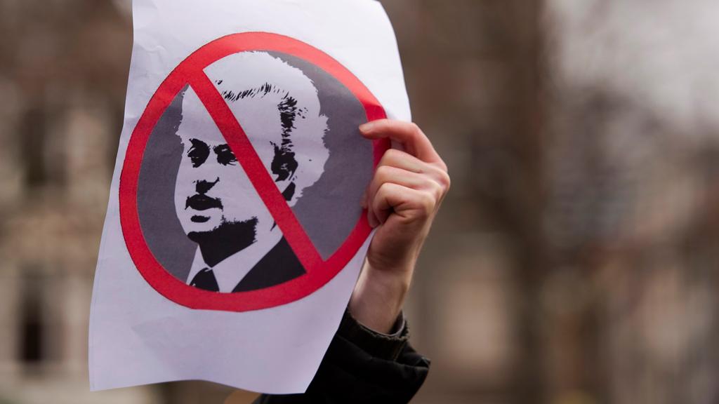 A protester holds an anti-Geert-Wilders sign in Amsterdam, the Netherlands (photo: Reuters)