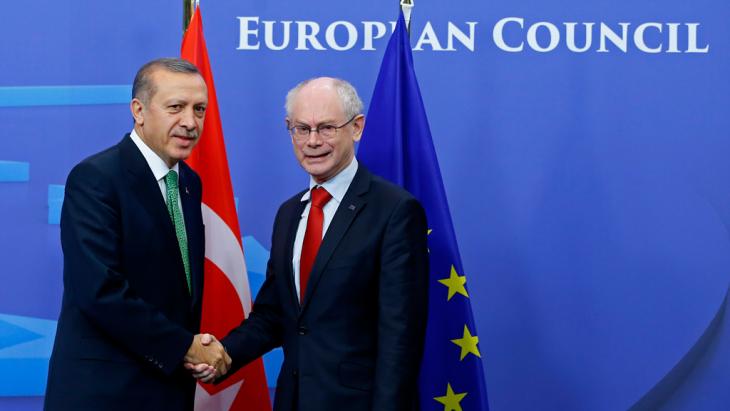 Turkish Prime Minister Recep Tayyip Erdogan and President of the European Council Herman Van Rompuy (right) shake hands in Brussels (Photo: Reuters)