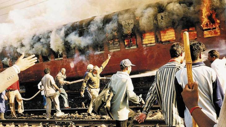 A burning train in Godhra railway station in February 2002 (photo: AP)