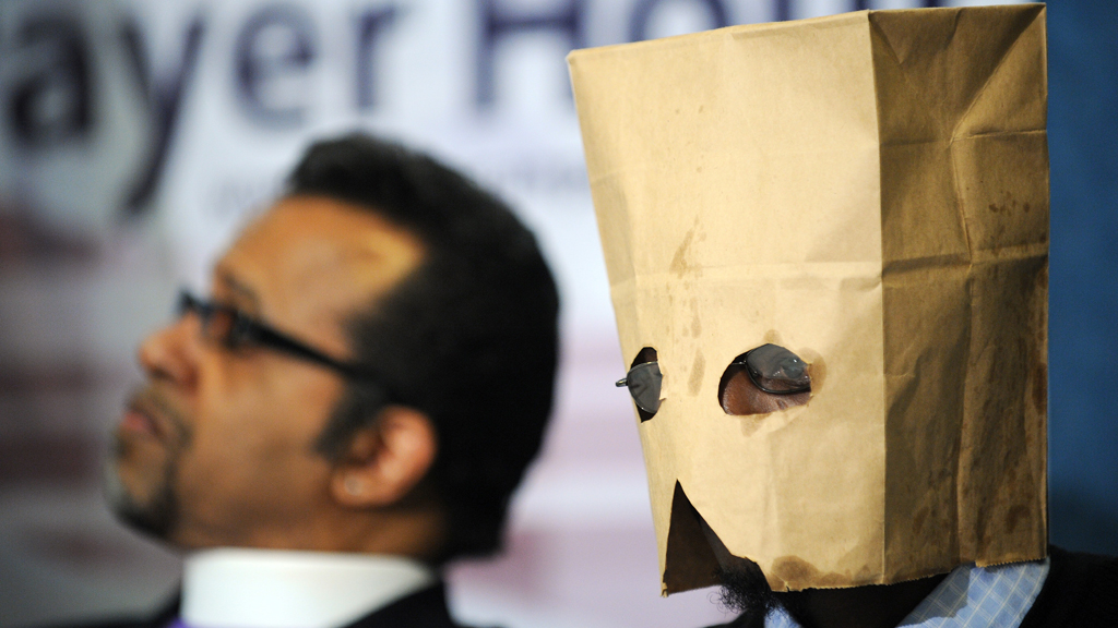 A gay Ugandan man seeking asylum in the US, hides his face with a hood at a press conference in Washington DC, February 2010 (photo: Jewel Samad/AFP/Getty Images)