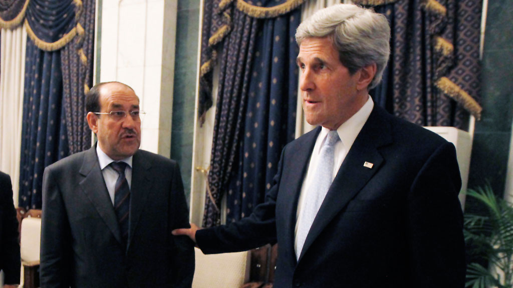 Nouri al-Maliki (left) and US Secretary of State John Kerry (photo: Getty Images)