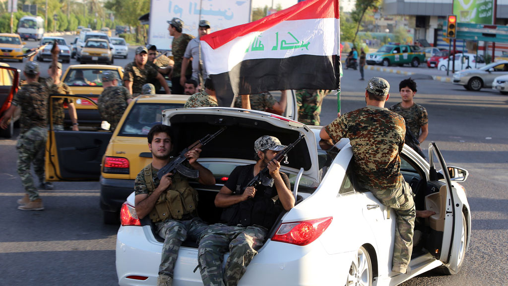 Iraqi Shia tribesmen driving around Baghdad (photo: AFP/Getty Images)