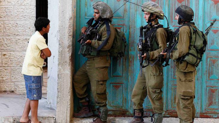 Israeli soldiers during a raid in Hebron (photo: Reuters/Ammar Awad)