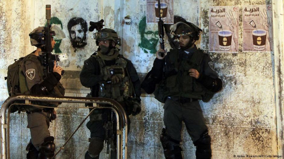 Israeli soldiers raiding a house in the West Bank, June 2014. Photo: AFP/Getty Images