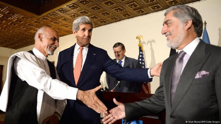 US foreign minister John Kerry, centre, with Ashraf Ghani Ahmadzai, left, and Abdullah Abdullah (photo: AFP/Getty Images)