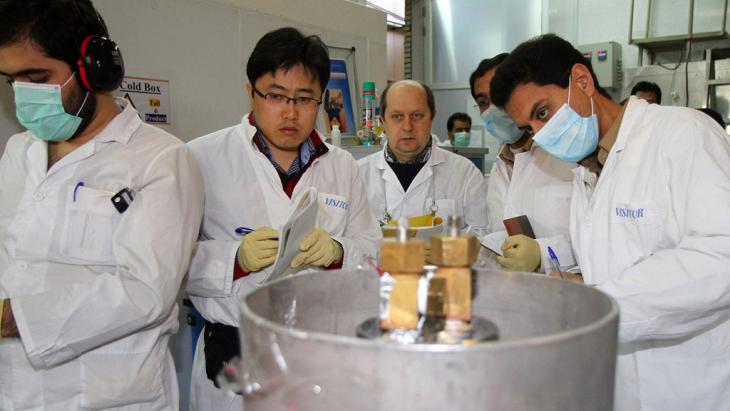 Inspectors from the International Atomic Energy Agency (IAEA) and Iranian engineers in the Natanz facility, Iran, on 20 January 2014 (photo: AFP/Getty Images)