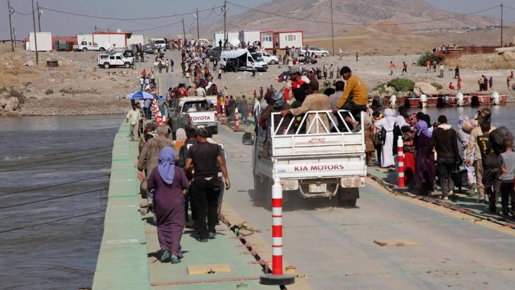 Yazidis who fled into Syria following violence in Sinjar, re-entering Iraq (photo: Reuters)
