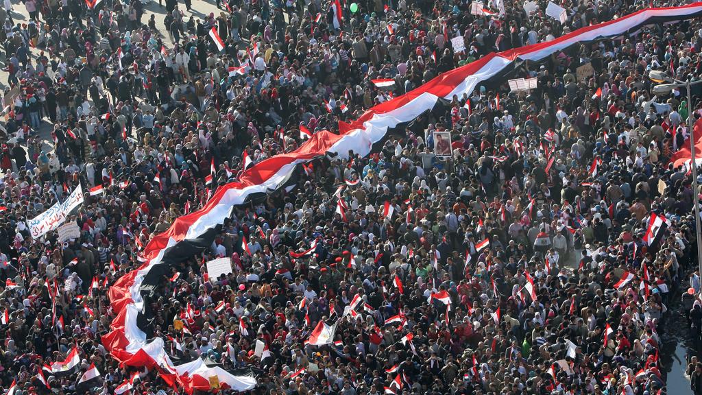 Egyptians celebrate the day marking one week after Egypt's president Hosni Mubarak was forced to step down by nation-wide mass protests in 2011 (photo: Mohammed Abed/AFP/Getty Images)