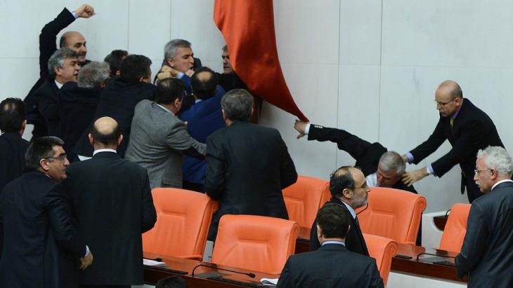 Members of the Turkish parliament from the AKP and CHP fighting in the parliament in Ankara (photo: AFP/Getty Images)