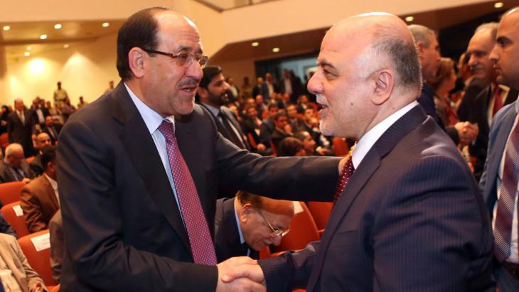 Nouri al-Maliki (left) congratulates Haider al-Abadi (photo: Reuters/Hadi Mizban)
