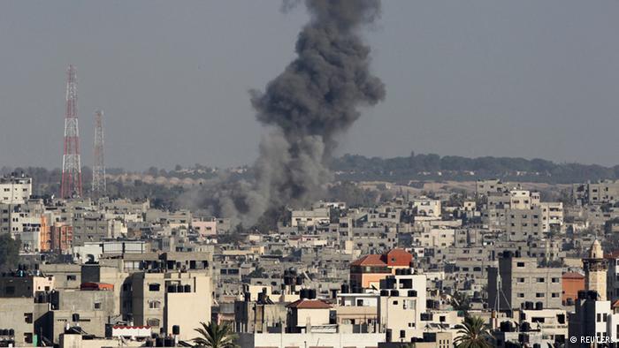 Gaza city under a cloud of smoke (photo: Reuters)