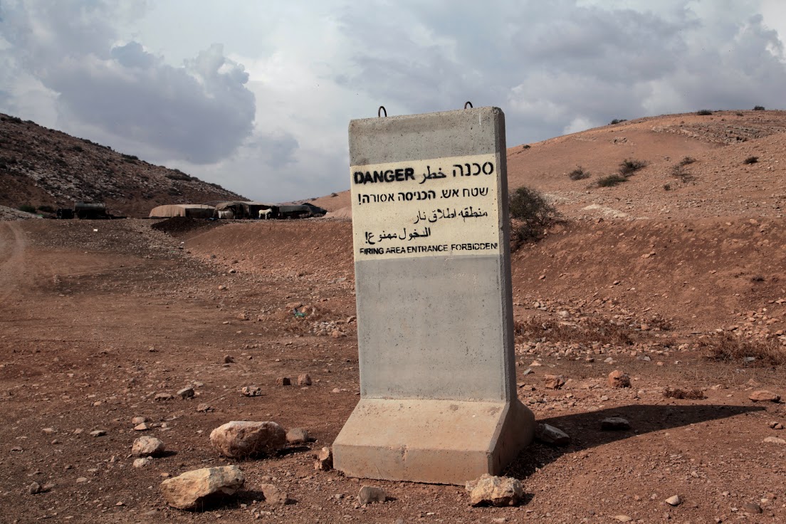 An Israeli military sign placed on Bedouin-inhabited land, West Bank, October 2014 (photo: Mohammad Alhaj) 