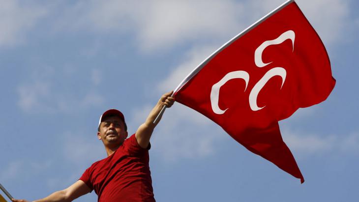 A supporter of the MHP waves his party's flag (photo: Reuters/Osman Orsal)