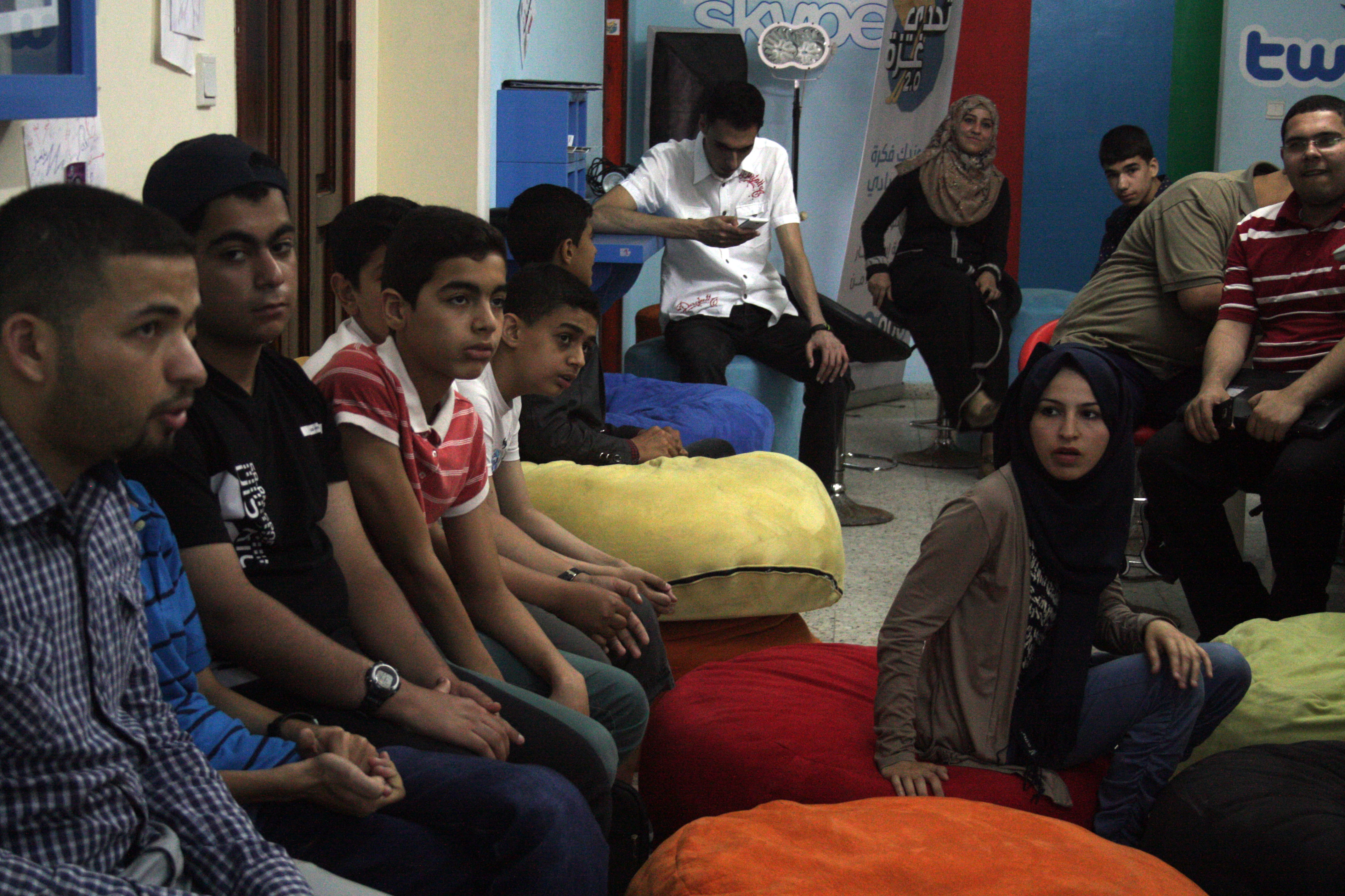 Young people listen to a presentation at the Gaza Sky Geeks co-working space (photo: Ylenia Gostoli)