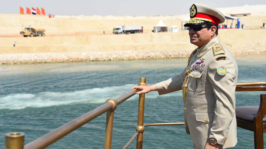Egyptian President Abdel Fattah al-Sisi stands in a boat on the Suez Canal as he attends the celebration of an extension of the Suez Canal in Ismailia, 6 August 2015 (photo: Reuters/The Egyptian Presidency)