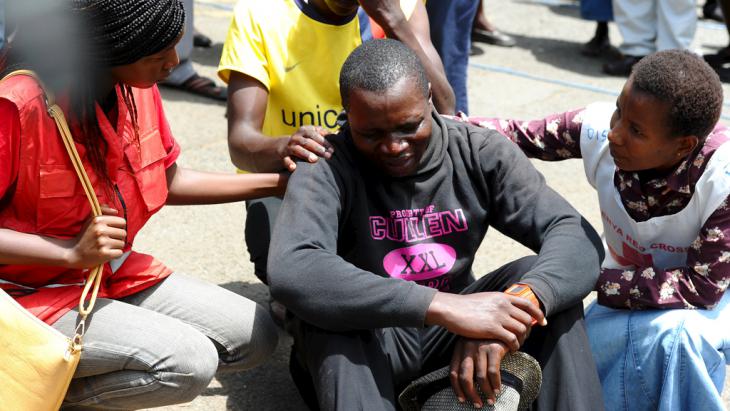 A man in distress after the attack on Garissa University in April 2015 (photo: Reuters/Herman Kairuki)