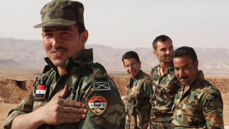 Soldiers loyal to the Assad regime (photo: picture-alliance(dpa/Dimitriy Vinogradov)