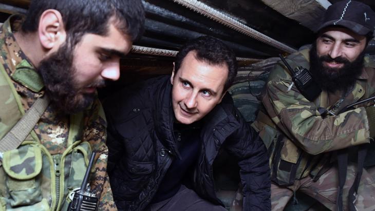 Syria’s president Bashar al-Assad visiting troops in Damascus (photo: AP)