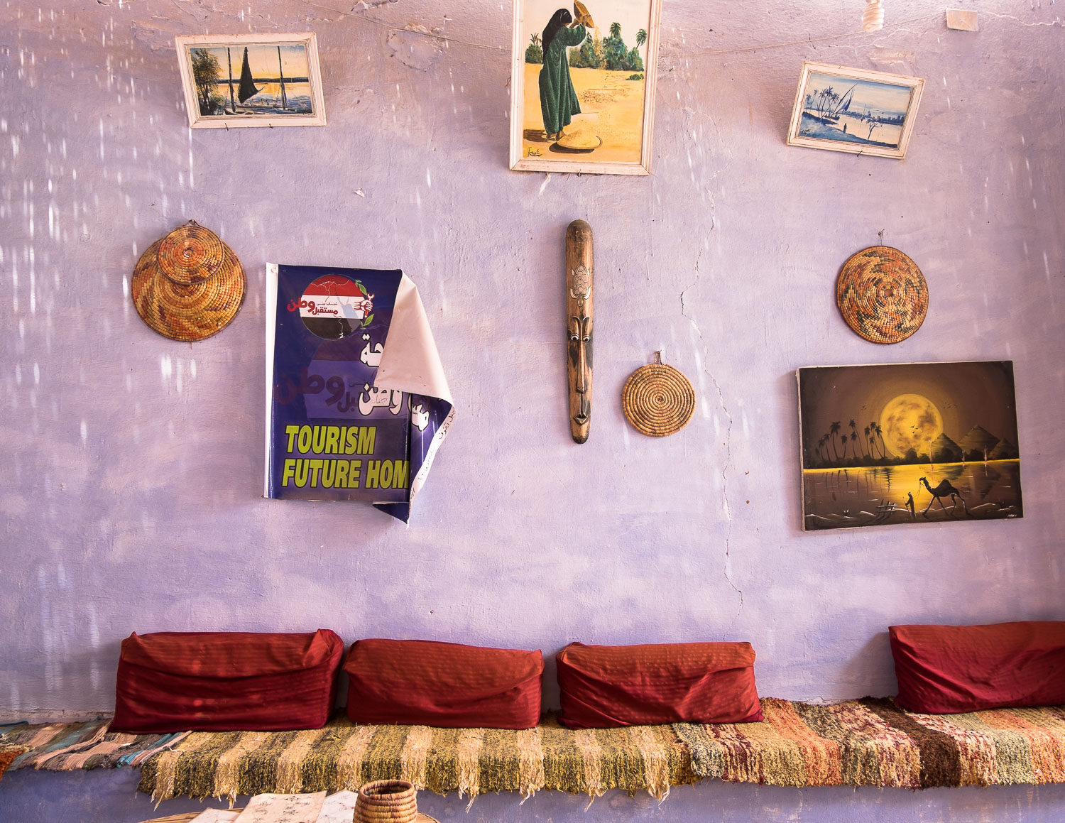 Tourism-related posters in a cafe in the Nubian village of Western Suheil (photo: Maya Hautefeuille)