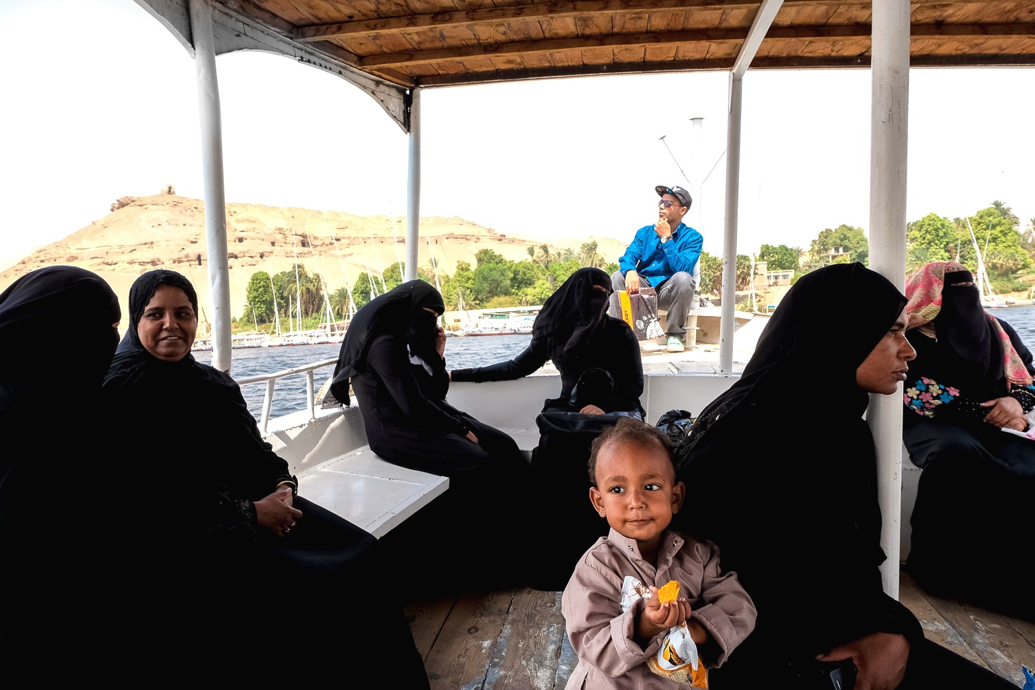 Women travelling to West Aswan on a river taxi (photo: Maya Hautefeuille)