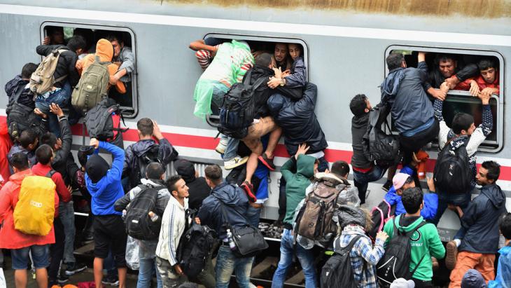 Refugees attempting to board an overcrowded train in Tovarnik, Croatia (photo: Getty Images/J. J. Mitchell)
