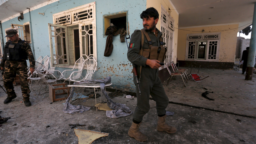 Afghan security forces inspect the site of a suicide attack in Jalalabad (photo: Reuters/Parwiz)