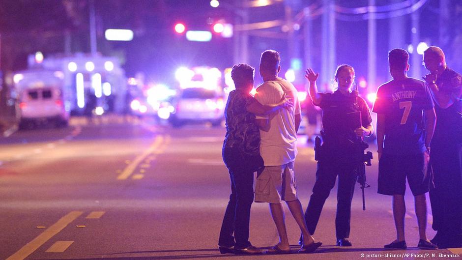 Orlando Police officers direct family members away from a fatal shooting at Pulse Orlando nightclub in Orlando, Fla., 12 June 2016 (photo: AP Photo/Phelan M. Ebenhack)