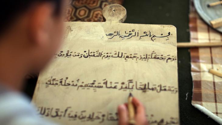 Boy studying the Koran in Tripoli (photo: MAHMUD TURKIA/AFP/Getty Images)