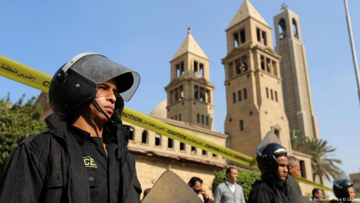 Police guard a Coptic church in Cairo (photo: Reuters)