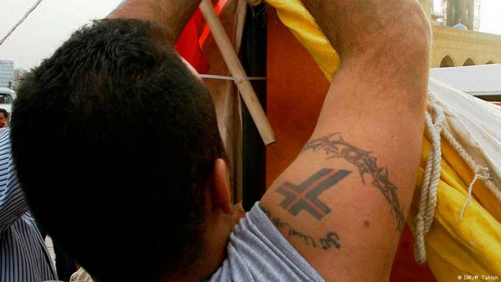 Man sporting a ″Lebanese Forces″ tattoo in Beirut (photo: Marwan Tahtah)