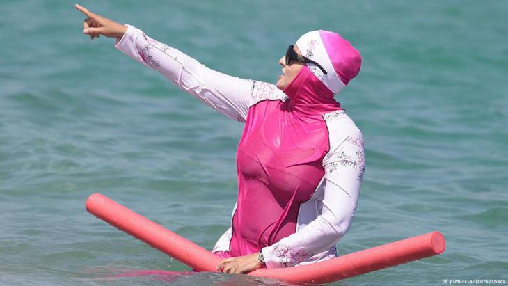 Muslim woman wears a burkini on a beach in southern France (photo: Reuters)