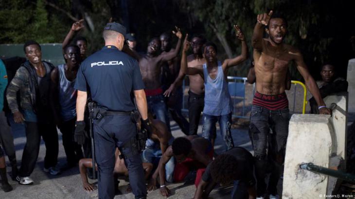 Spanish police prevent African refugees from entering Ceuta (photo: Reuters)