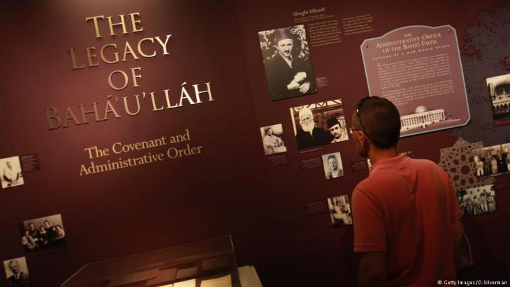 A visitor at an exhibition in Haifa about the founder of the Baha'i religion, Baha'u'llah (photo: Getty images)