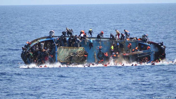 Capsizing refugee boat in the Mediterranean (photo: Reuters)