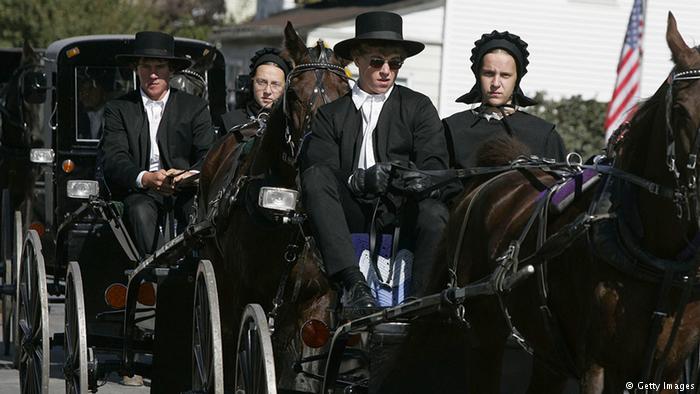 Amish people driving a buggy (photo: Getty Images)