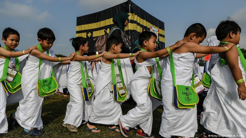 Ihram-clad Malaysian Muslim boys from the Little Caliphs kindergarten circumambulate a mockup of the Kaaba, Islam's most sacred structure located in the holy city of Mecca, during an educational simulation of the Hajj pilgrimage in Shah Alam, outside Kuala Lumpur on 24 July 2017 (photo: MOHD RASFAN/AFP/Getty Images)