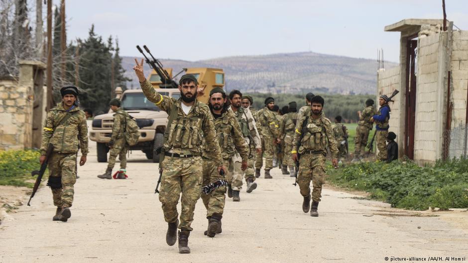 Free Syrian Army members patrol as Turkish Armed Forces and Free Syrian Army (FSA) liberate 16 more villages and a strategic mountain within the "Operation Olive Branch" and deployed forces only 1.5 kilometres away from the town of Afrin in Syria on 12 March 2018 (photo: picture-alliance /AA/H. Al Homsi)