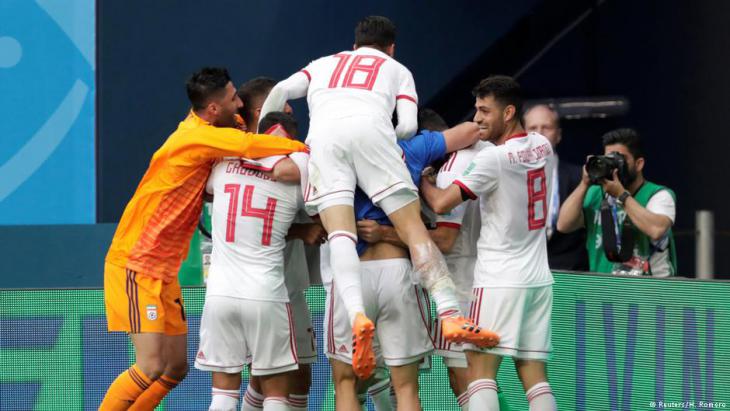 Iranian team members celebrate an unexpected victory (photo: Reuters)