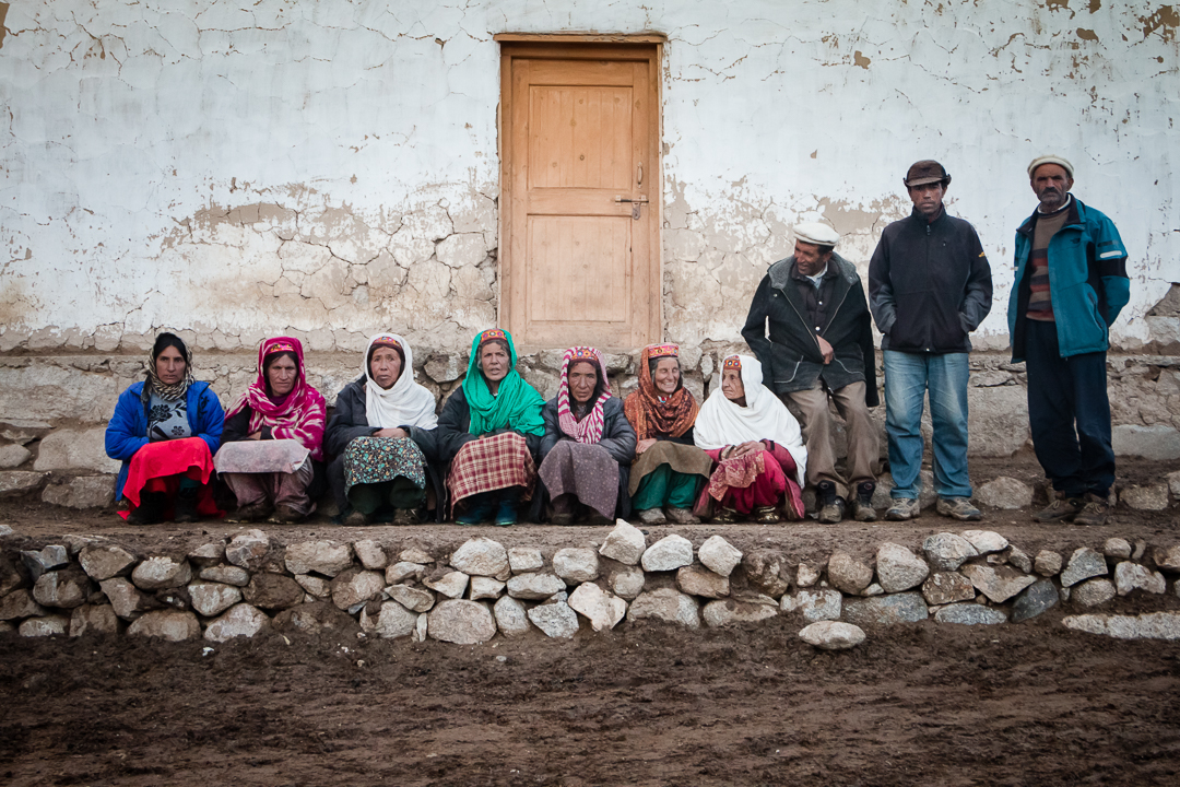 Wakhi people sitting in front of a "jamaat khana" (photo: Camille Del Bos)