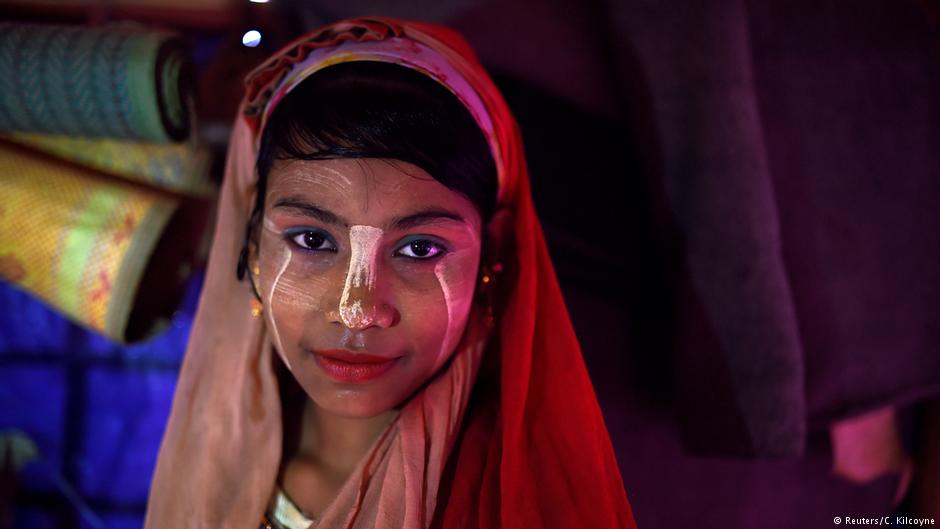 A Rohingya refugee girl named Senuara Begum, aged 14, poses for a photograph as she wears thanaka paste at Jamtoli camp in Cox's Bazaar, Bangladesh, 1 April 2018 (photo: Reuters/Clodagh Kilcoyne)