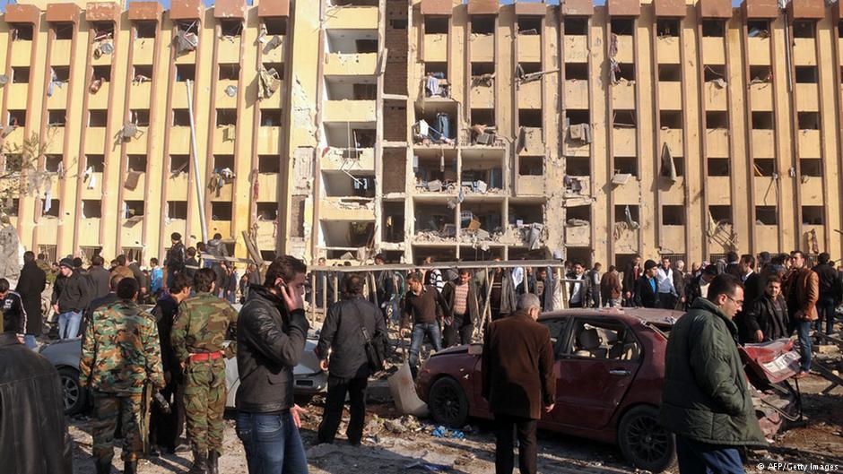 Syrians gather at the scene of an explosion outside Aleppo University, between the university dormitories and the architecture faculty, on 15 January 2013 (photo: AFP/Getty Images)