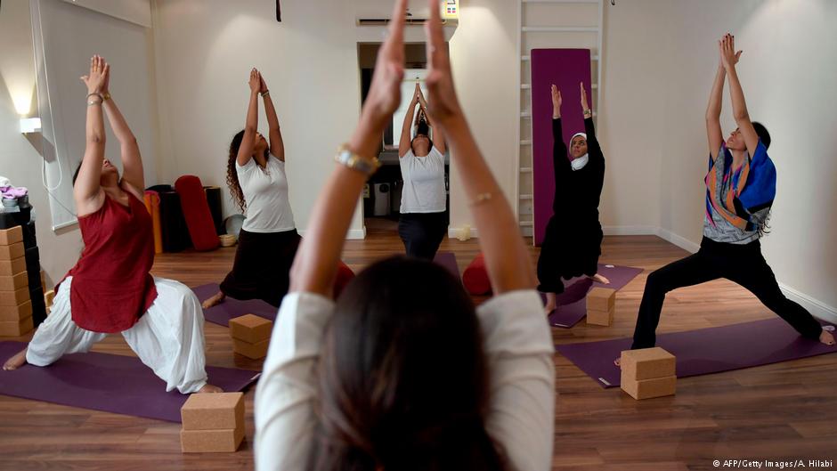 : Nouf Marwaai, 38, the head of the Arab Yoga Foundation (foreground), instructs her yoga students with at her studio in the western Saudi Arabian city of Jeddah on 7 September 2018 (photo: AFP/Getty Images/A. Hilabi)
