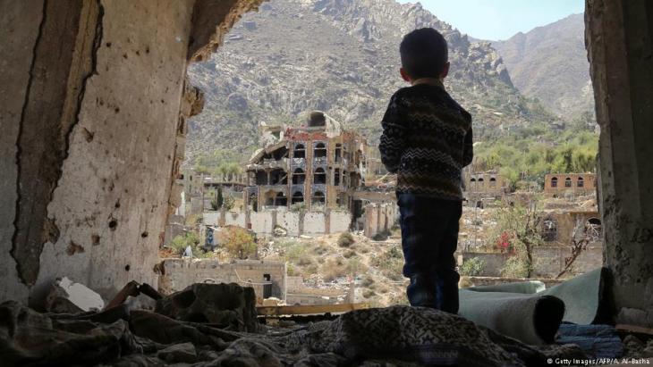 Child standing in the ruins of Taiz, Yemen (photo: Getty Images/AFP)